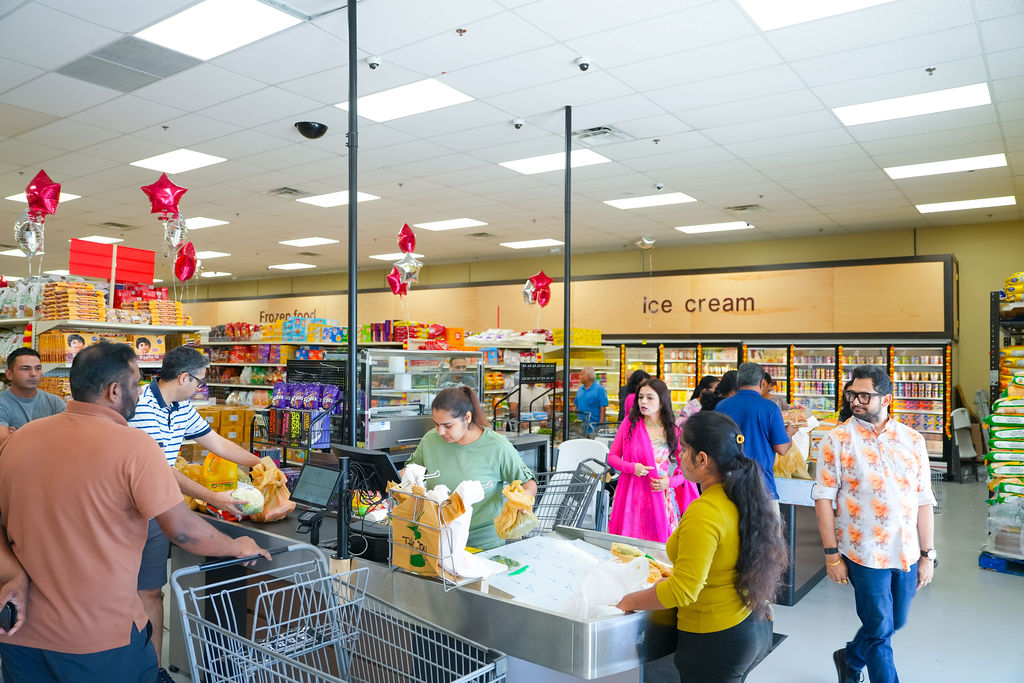 Checkout lane and ice cream freezers at Reliance Mart