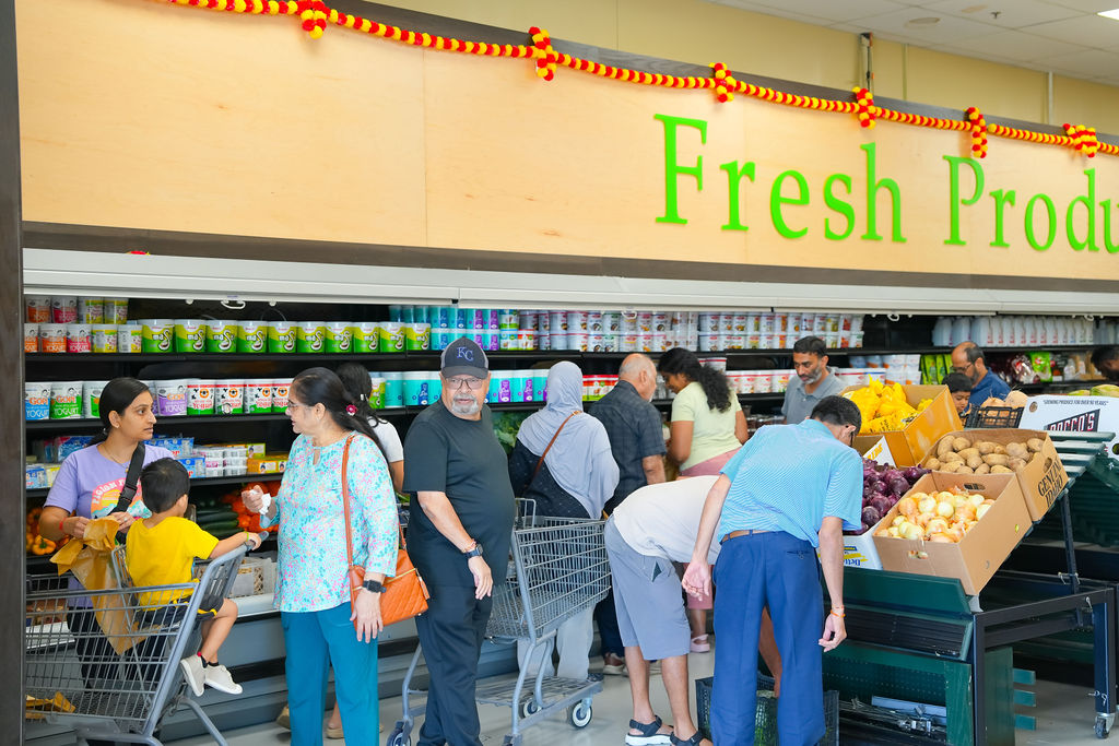 Families shopping fresh produce at Reliance Mart