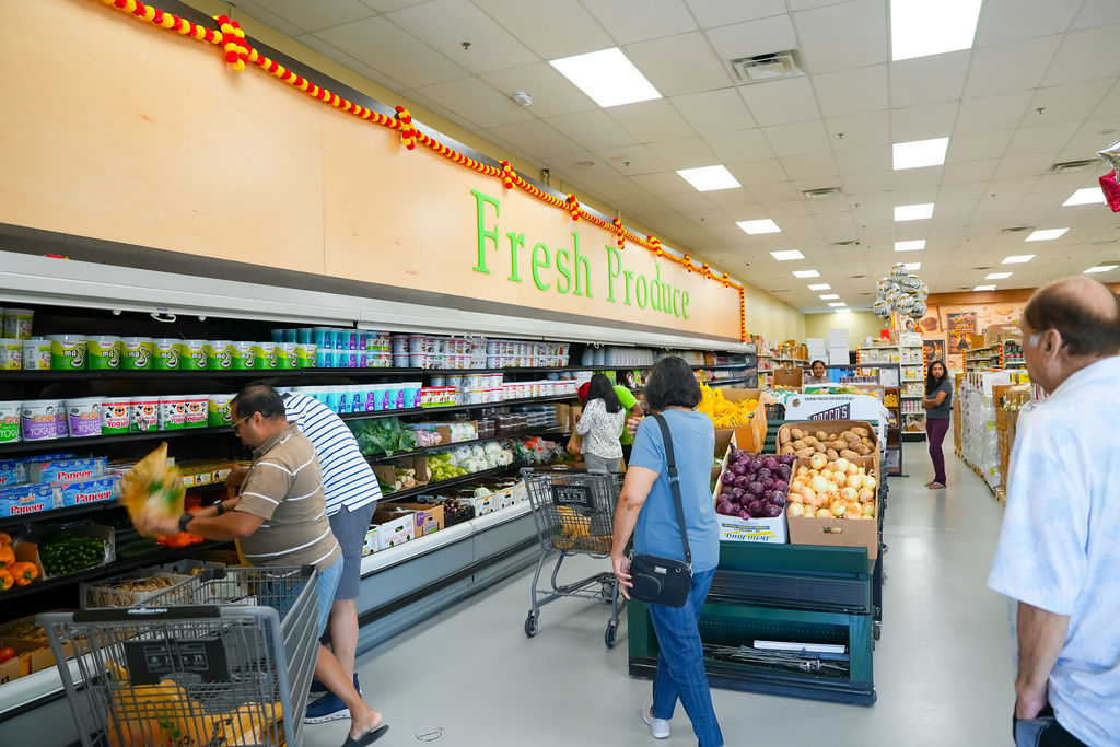 Customers browsing the Fresh Produce section at Reliance Mart