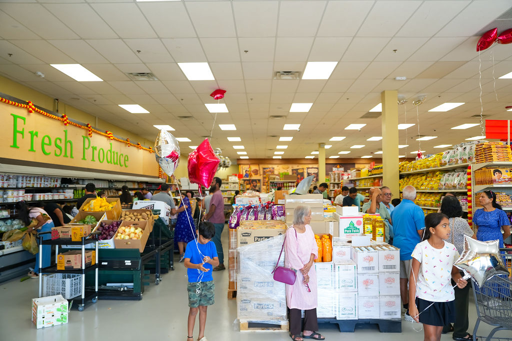 Kids with balloons at the Reliance Mart grand opening